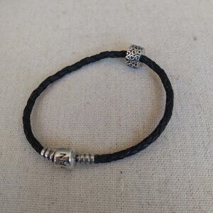 Pandora: Black leather rope charm bracelet with charm.